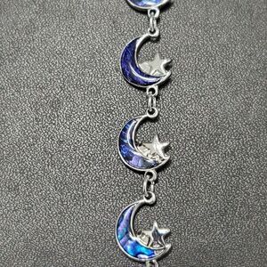 Silver tone star and moon bracelet 7.25"